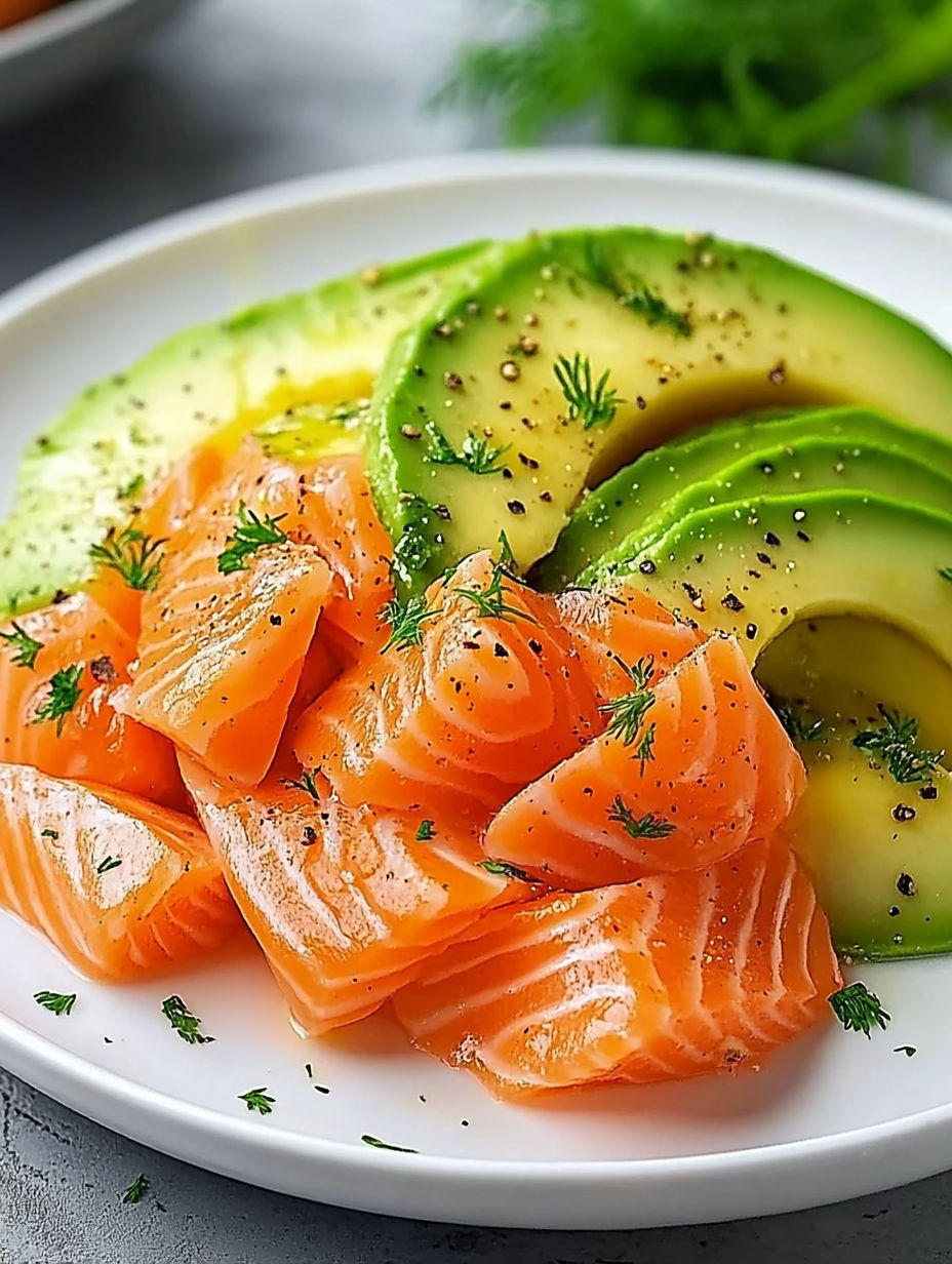 A plate of food with fish and avocado.