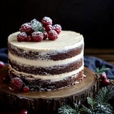 A vegan cake with raspberries on top.